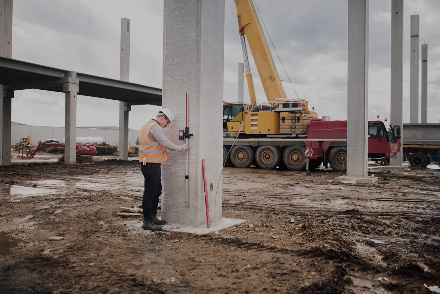 survey engineer in prefabricated construction site using special